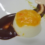 Panna cotta with chococlate, jam and pistachios